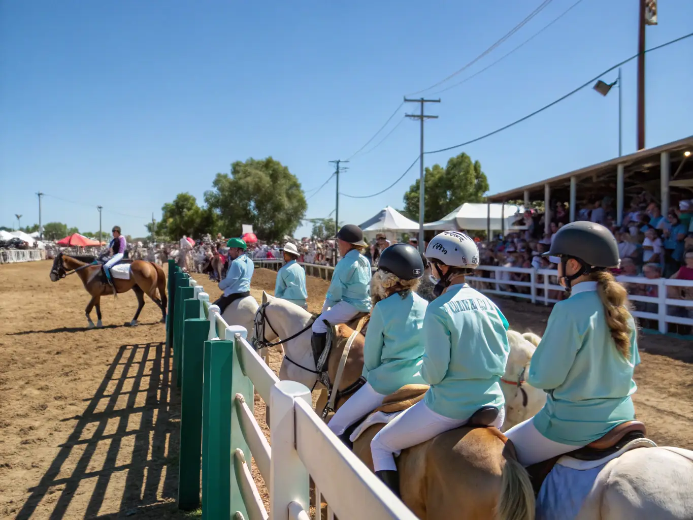 A lively community gathering with riders, families, and cultural displays celebrating Western riding traditions.